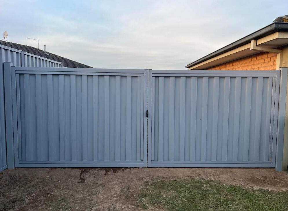 Custom 4m wide Bluegum Colorbond driveway gates completed in Trafalgar featuring reinforced steel frames and heavy-duty posts for secure long-lasting vehicle access.