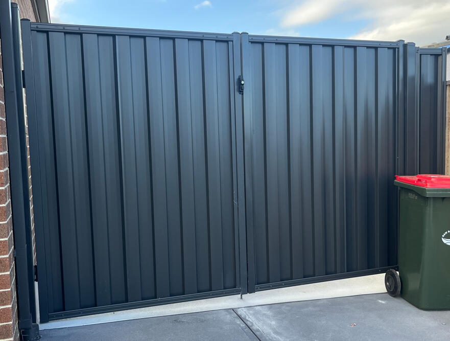 Monument Colorbond double driveway gates with welded frames installed in Warragul. Heavy-duty Monument Colorbond double gates with reinforced welded frames completed for a repeat customer in Warragul, designed for secure driveway access and long-lasting performance.
