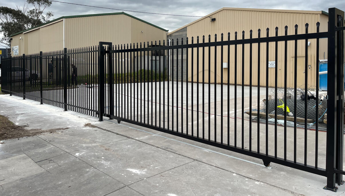 Commercial security fencing project completed in Seaford featuring three 6m x 2.1m motorised sliding gates and 30m of matching spear-top steel fencing to prepare the property for sale.