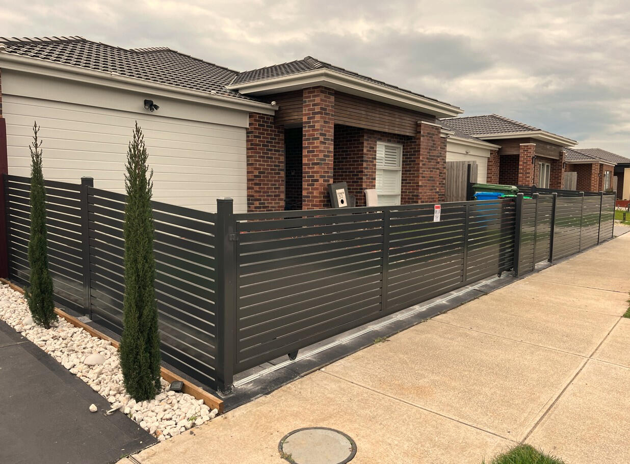 6m Monument aluminium slat motorised sliding gate with lockable pedestrian access gate and remote control system completed for a repeat customer in Cranbourne East.