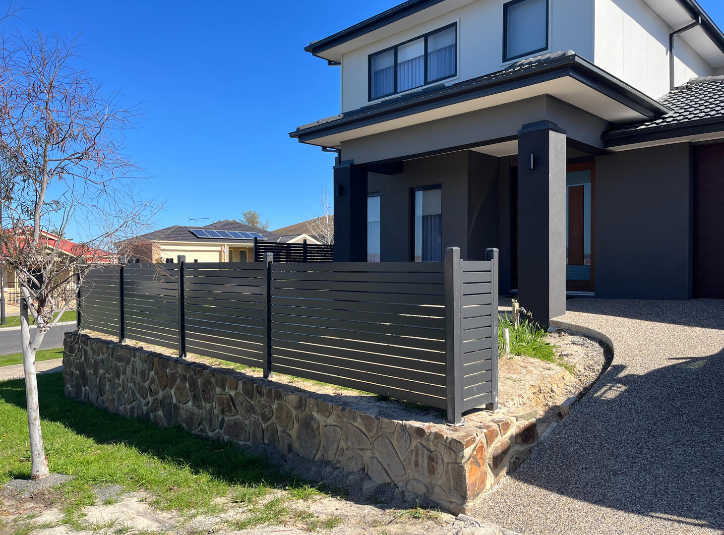 1.2m high aluminium slat front fence completed in Pakenham featuring 10mm slat spacing for a modern low-maintenance architectural finish.