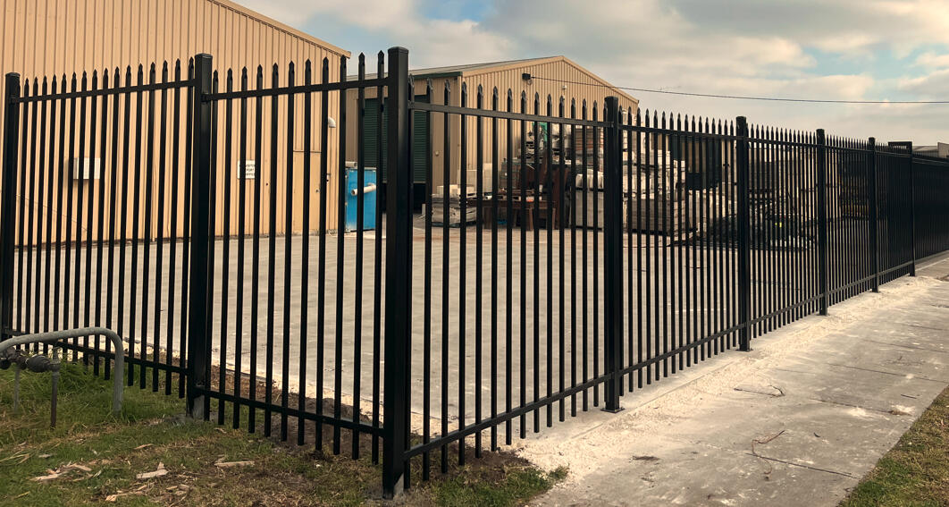 2.1m high black spear-top steel security fencing completed for a commercial factory in Seaford, designed for improved perimeter security and industrial property protection.