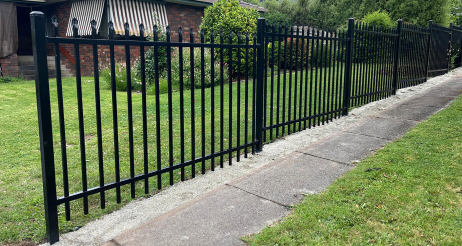 1.5m high black spear-top security fencing completed in Drouin featuring stepped panel design for a sloping front boundary and improved residential security.