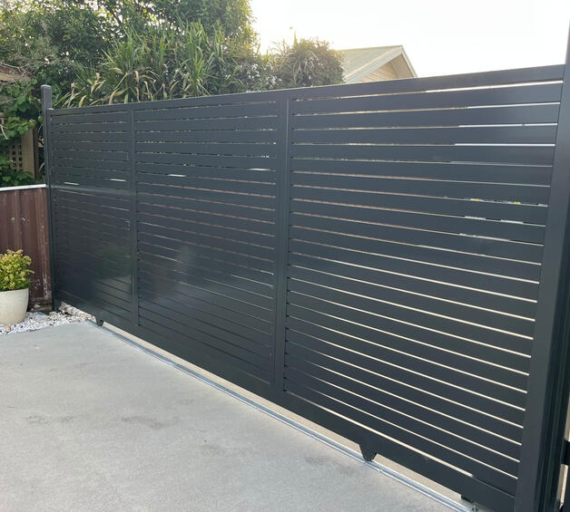 Aluminium slat sliding gate with remote-controlled motor installed in Moe. 4m motorised aluminium slat sliding gate completed in Moe featuring remote-controlled access system for improved driveway security, privacy and modern street appeal.