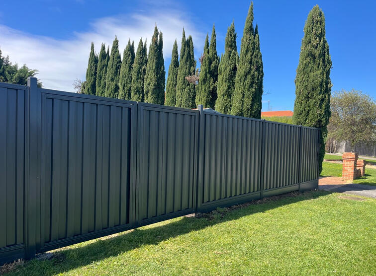 Colorbond Gates & Fence - Narre Warren North Colorbond fence Woodland Grey with timber sleepers installed in Officer